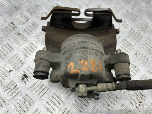 Суппорт тормозной, передний, левый LR061370 LAND ROVER