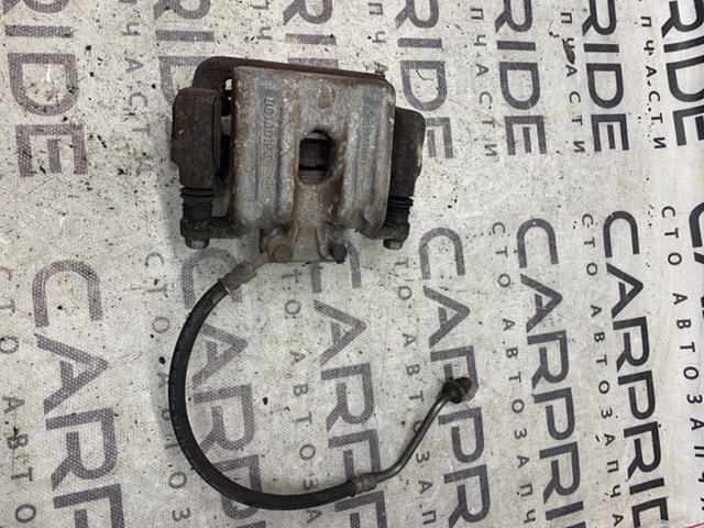 Задний левый суппорт 582100W000 HYUNDAI