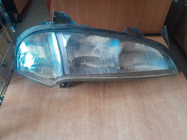 Вставка фары правой 90511130 OPEL