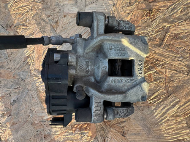 Суппорт тормозной левый задний JX6Z2386M FORD