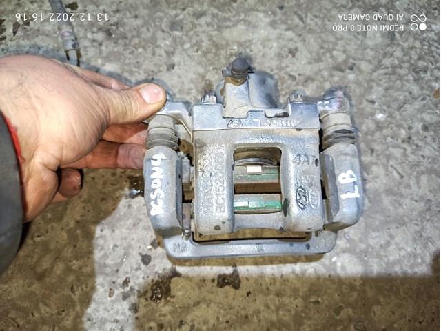 Задний левый суппорт 582103Q100 HYUNDAI