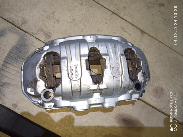 Суппорт тормозной, передний, левый 95B615123A PORSCHE