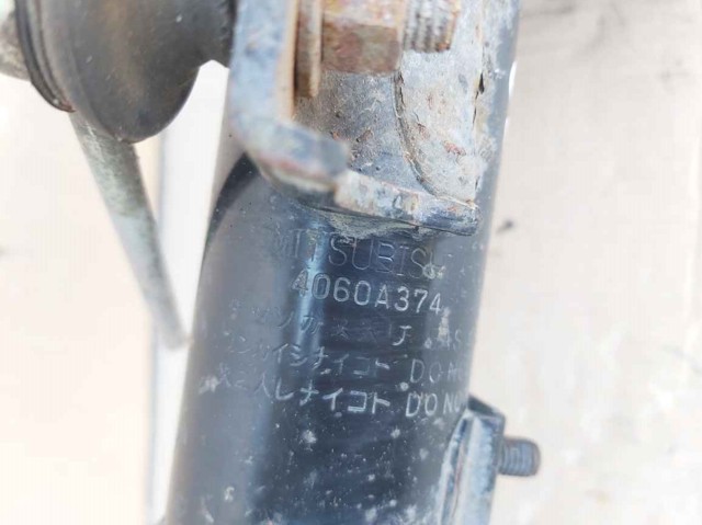 Амортизатор подвески передний левый 4060A374 MITSUBISHI