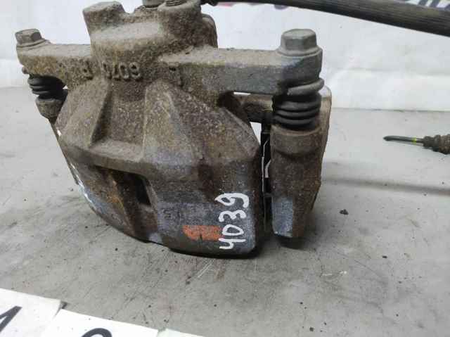 Суппорт тормозной передний левый K0Y13399Z MAZDA