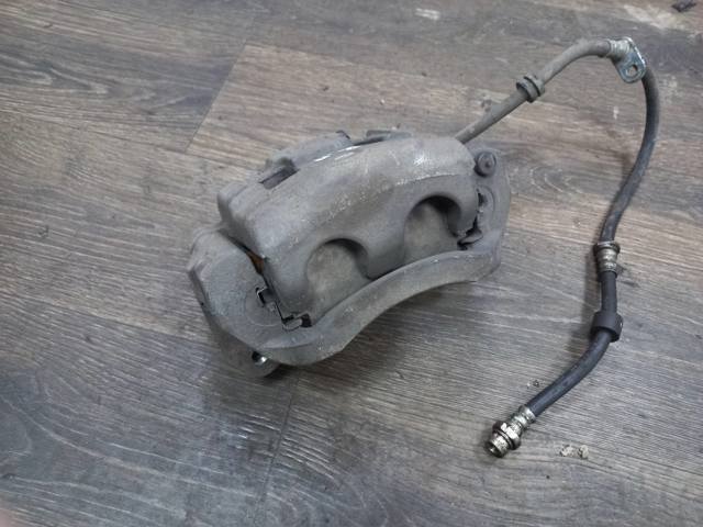Суппорт тормозной, передний, левый 41011W000P MITSUBISHI