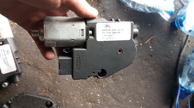 Мотор привода люка B9230110 FORD