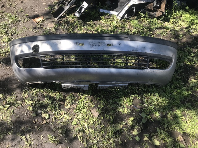 Передний бампер 9119200 GM