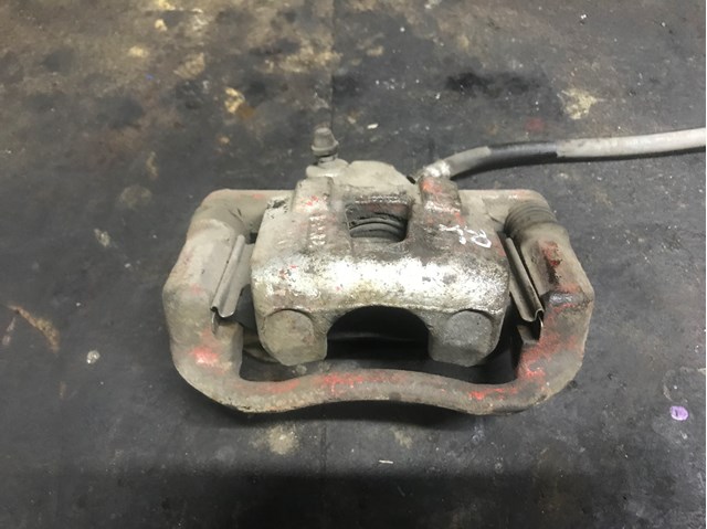 Суппорт тормозной левый задний 96475840 GM