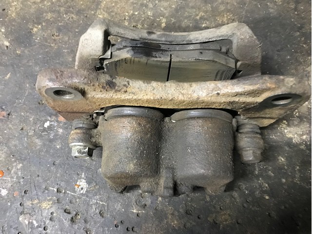 Суппорт тормозной передний левый LC623371X MAZDA