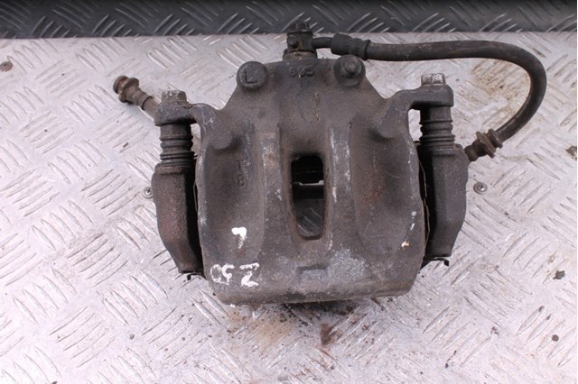 Суппорт тормозной передний левый 41011CA01A NISSAN