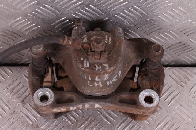Суппорт тормозной передний левый 41011ET00A NISSAN