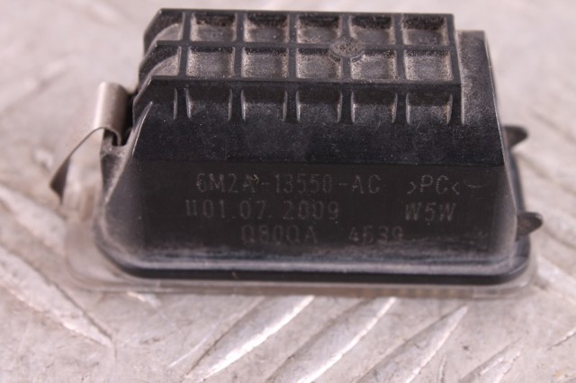 Фонарь подсветки заднего номера 6M2A13550AC JAGUAR