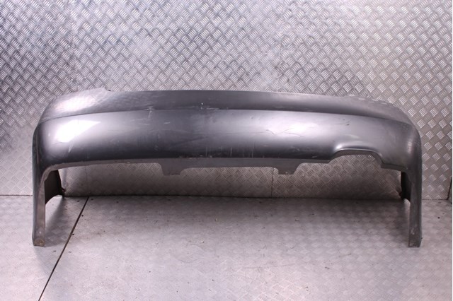 Бампер задний 850228J040 NISSAN