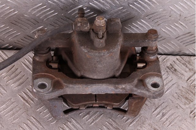 B4Y03399ZB MAZDA Суппорт тормозной передний левый купить в Сумы
