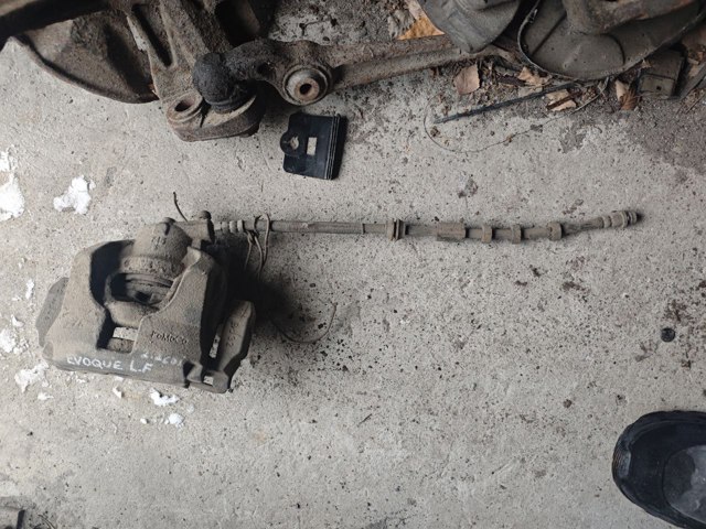 Суппорт тормозной, передний, левый LR015387 LAND ROVER