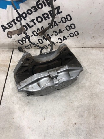 Суппорт тормозной, передний, левый 41011JL00A NISSAN
