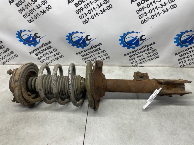 Амортизатор задней подвески, левый 553038H327 NISSAN