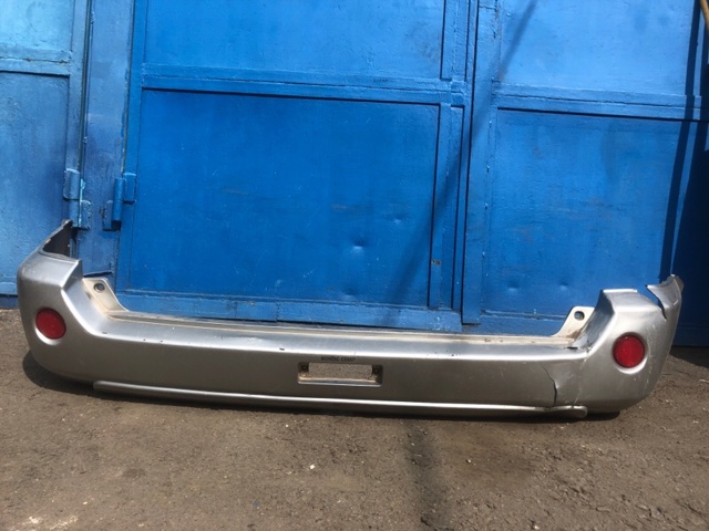 Задний бампер 85022EQ025 NISSAN