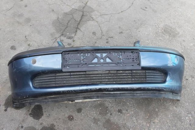 Бампер передний 90464527 OPEL