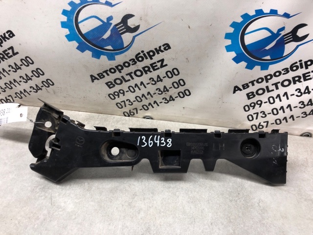 Кронштейн бампера заднего, внешний левый BHN9502J1C MAZDA