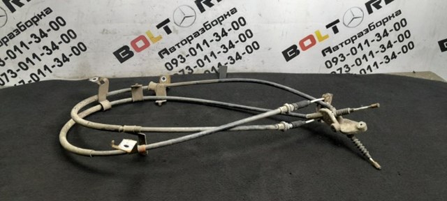 EG2144420F MAZDA Трос ручного тормоза задний левый купить в Киев