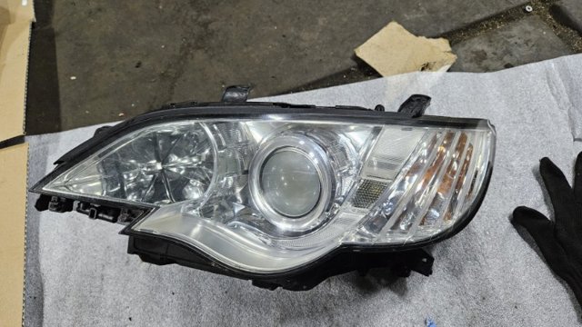 Фара левая 84001AG390 SUBARU