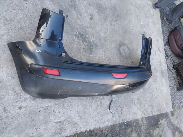 Задний бампер 850229U040 NISSAN