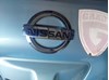 Фирменныйзначок 908903NA0A NISSAN