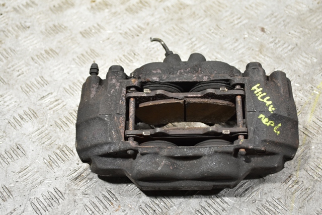 Суппорт тормозной, передний, левый 477500K190 TOYOTA