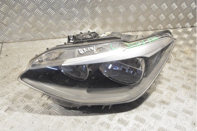Вставка фары левой 7229671 BMW