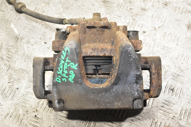Суппорт тормозной, передний, правый LR061369 LAND ROVER