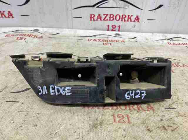 Левый кронштейн крепления бампера заднего KT4Z17D943A FORD