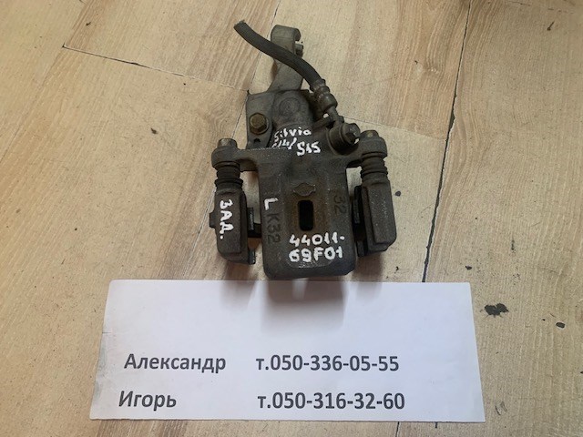 Суппорт тормозной левый задний 4401169F01 NISSAN