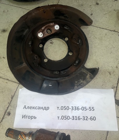 Пыльник тормозного диска заднего левый 44030WL001 NISSAN