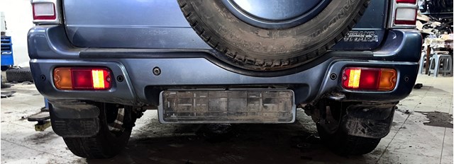 Бампер задний 7181165DD1799 SUZUKI