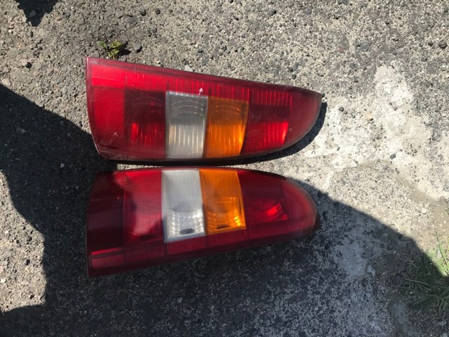 Фонарь задний  левый 9117210  красно-дымчатый  (sedan) opel astra g 1998-2007 9117210