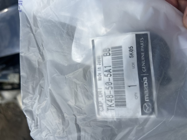 Заглушка бампера буксировочного крюка, задняя TK48505A1BB MAZDA