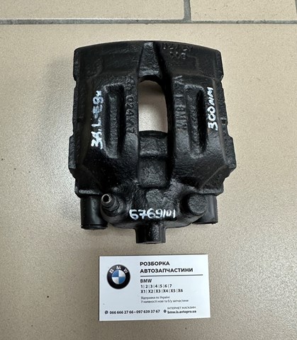 Суппорт тормозной левый задний 34216769101 BMW