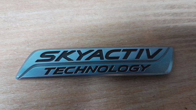 Логотип "skyactiv technology" кришки багажника mazda 3 bm 2013- оригінал (ціну та стан уточнюйте) www.o-parts.com.ua BHN151771
