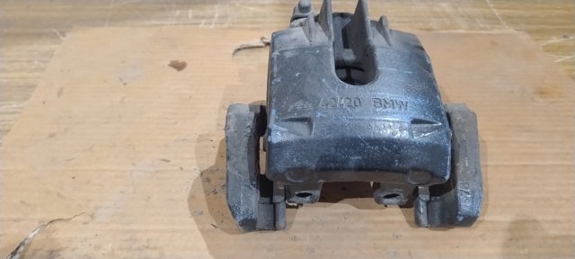 Суппорт тормозной левый задний 34216765909 BMW