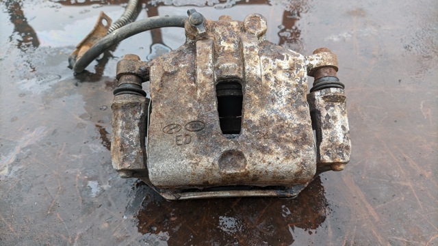 Суппорт тормозной передний левый 581101H000 HYUNDAI
