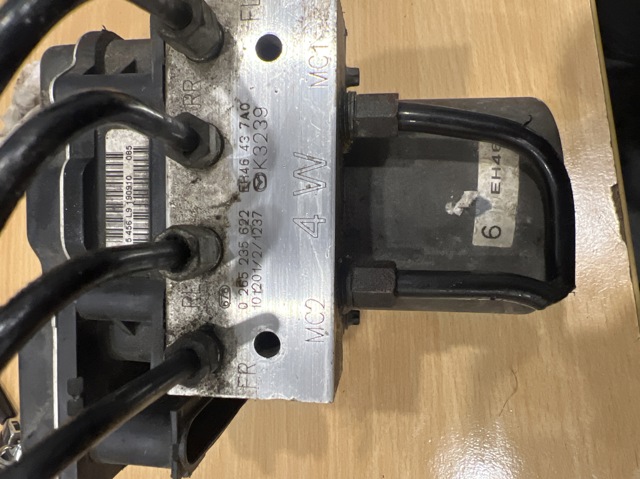 Блок ABS гидравлический EH46437A0 MAZDA