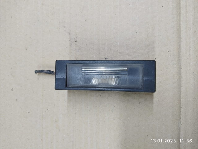 Фонарь освещения номерного знака 7165735 BMW