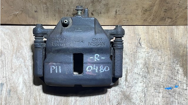 410012F021 NISSAN Суппорт тормозной передний правый купить в Чернигов