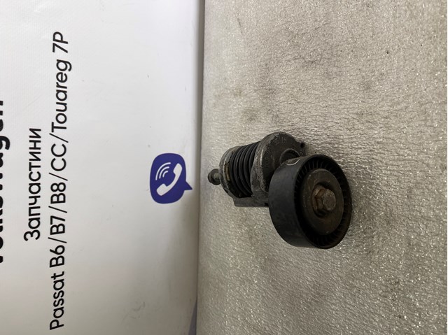 Натяжитель клинового ремня 038903315AH VAG