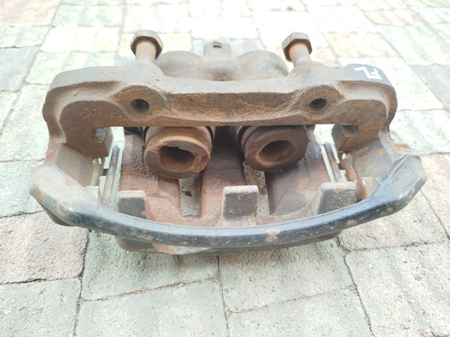 Суппорт тормозной, передний, левый 4101157G00 NISSAN