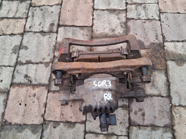 Суппорт тормозной задний правый 582303E000 HYUNDAI