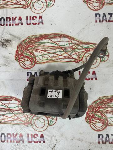 Суппорт тормозной, передний, правый 26292SC021 SUBARU
