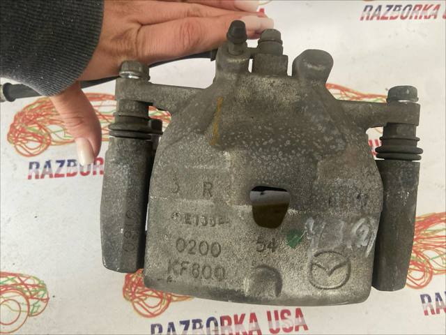 Суппорт тормозной, передний, правый B4Y03398ZB MAZDA