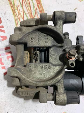 Задний левый суппорт DG9Z2553C FORD